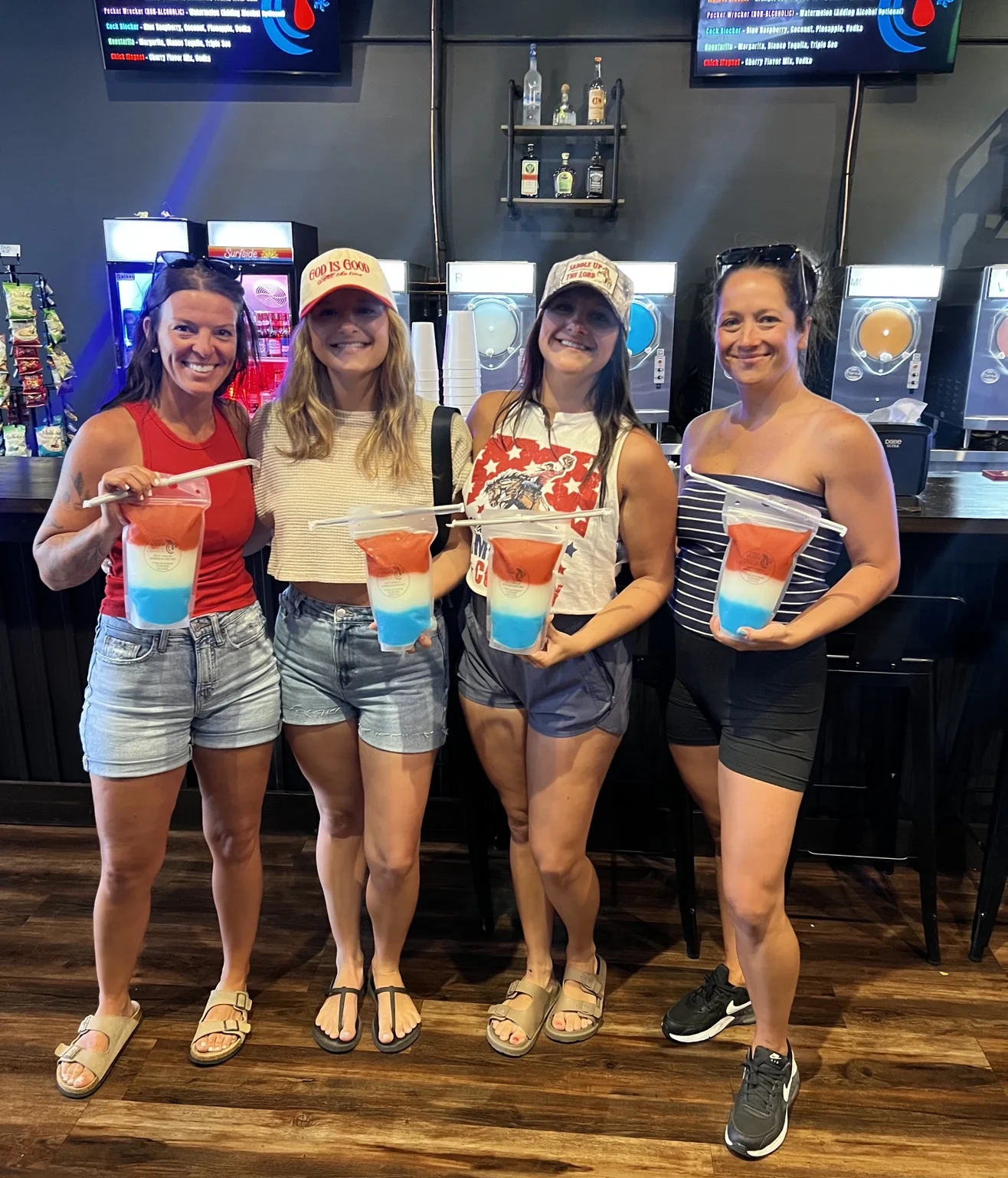Customers holding Cold Cocked layered frozen drinks