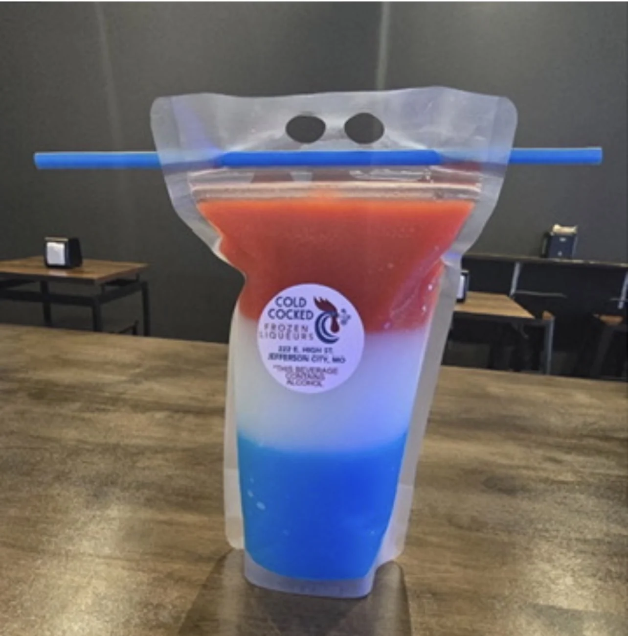 Red white and blue layered Cold Cocked frozen drink in a to-go pouch